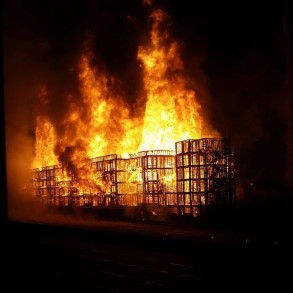 construction project on fire in the middle of the night